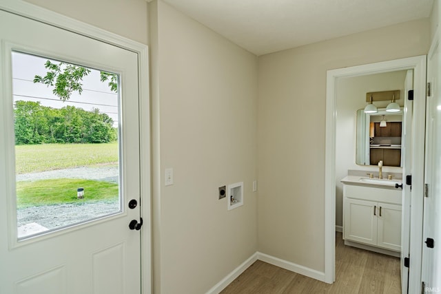 2135 Old Oak Dr, West Lafayette, IN 47906 - washroom with hookup for a washing machine, light wood-style flooring, and baseboards