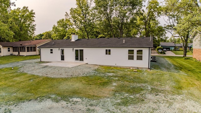 2135 Old Oak Dr, West Lafayette, IN 47906 - rear view of property featuring a patio, a chimney, central AC unit, and a yard