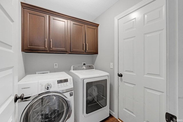 15926 Continental Dr, Huntertown, IN 46748 - laundry room featuring cabinet space, independent washer and dryer, and a textured ceiling