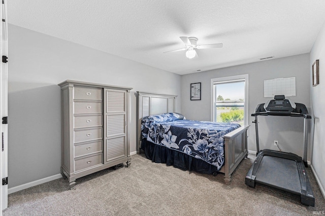 15926 Continental Dr, Huntertown, IN 46748 - bedroom featuring carpet floors, baseboards, ceiling fan, and a textured ceiling