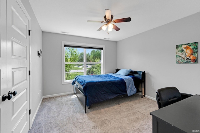 15926 Continental Dr, Huntertown, IN 46748 - bedroom featuring baseboards, light carpet, a desk, and ceiling fan