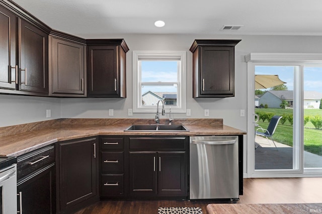 15926 Continental Dr, Huntertown, IN 46748 - kitchen with dishwasher, a sink, plenty of natural light, dark wood finished floors, and recessed lighting