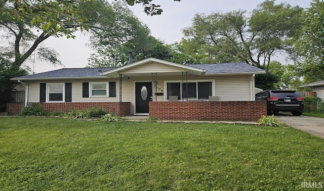 1104 Alder Dr, Lafayette, IN 47909 - ranch-style home with a front lawn, brick siding, a porch, and roof with shingles