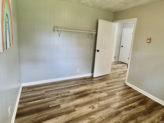 42 Center St, Avoca, IN 47420 - spare room with wood finished floors and baseboards