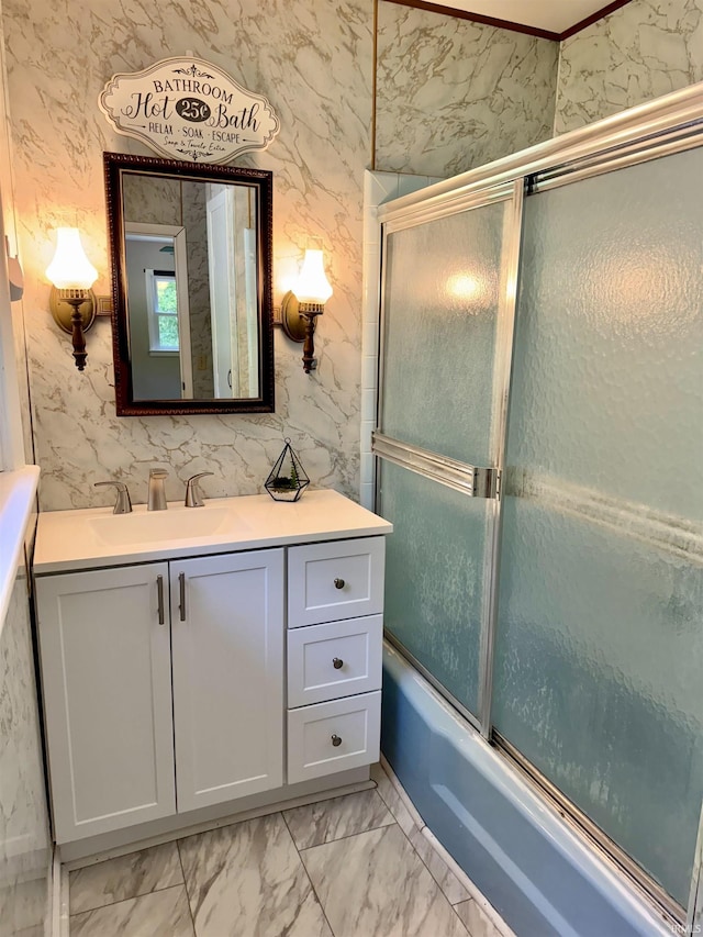 42 Center St, Avoca, IN 47420 - bathroom with vanity, marble look tiles, and combined bath / shower with glass door