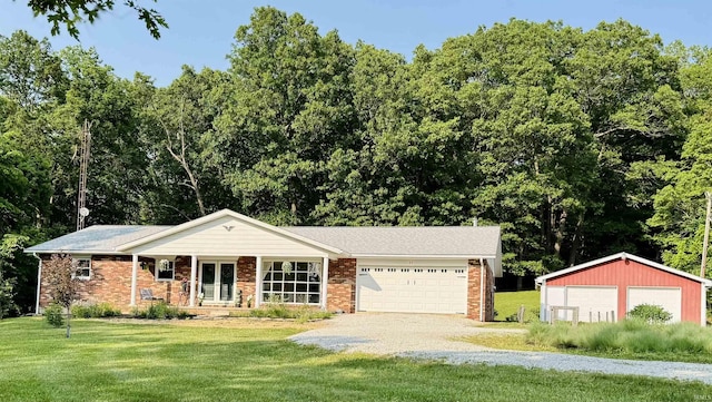 42 Center St, Avoca, IN 47420 - ranch-style home featuring a front yard, brick siding, and driveway