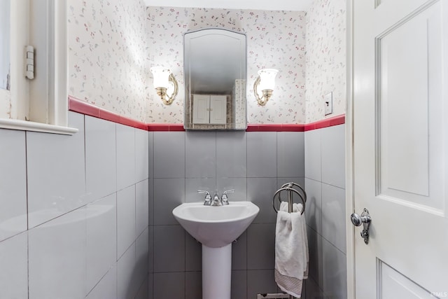308 N Forest Ave, Muncie, IN 47304 - half bath with wallpapered walls, wainscoting, tile walls, and a sink