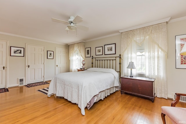 308 N Forest Ave, Muncie, IN 47304 - bedroom featuring light wood-style flooring, ornamental molding, a ceiling fan, and baseboards