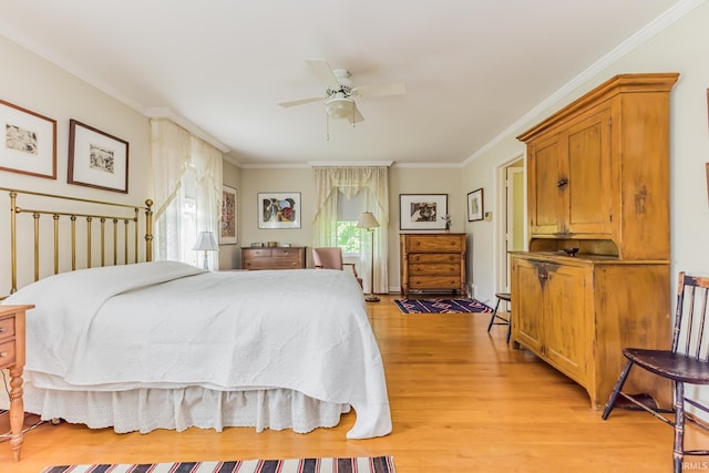 308 N Forest Ave, Muncie, IN 47304 - bedroom with light wood finished floors, ornamental molding, and a ceiling fan