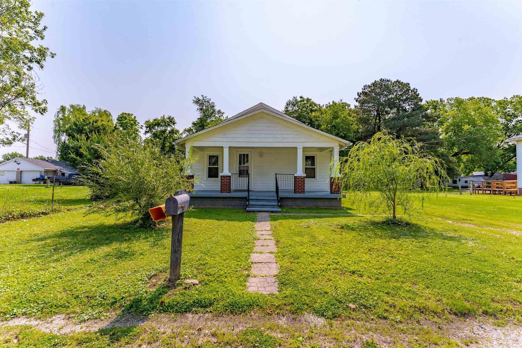 413 S E St, Rockport, IN 47635 - bungalow-style home featuring covered porch and a front lawn