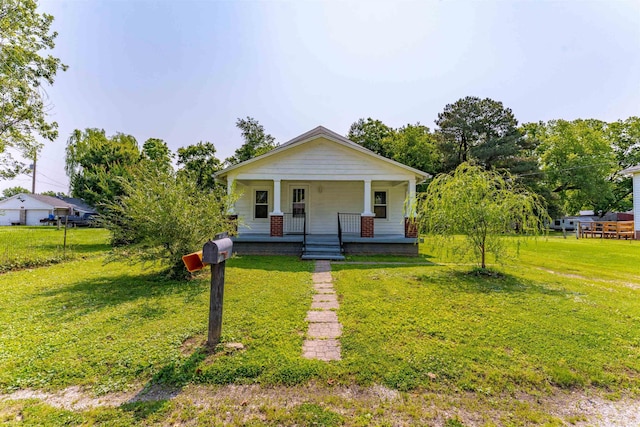 413 S E St, Rockport, IN 47635 - bungalow-style home featuring covered porch and a front lawn