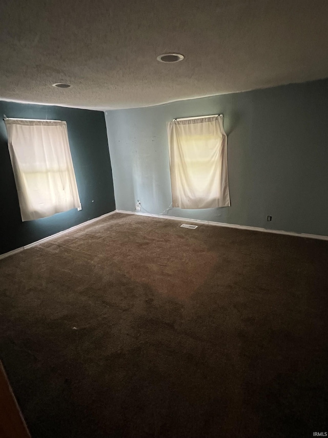 443 S State St, Sullivan, IN 47882 - carpeted empty room featuring baseboards and a textured ceiling