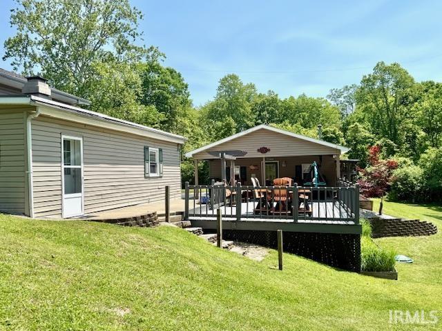 981 Keyser Ln, Richmond, IN 47374 - back of property with a lawn, a deck, and view of scattered trees