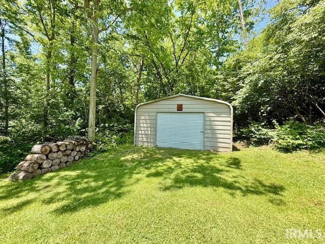981 Keyser Ln, Richmond, IN 47374 - garage featuring a storage shed