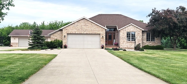 360 E 350 Rd N, Warsaw, IN 46582 - single story home with brick siding, a front lawn, driveway, and a garage