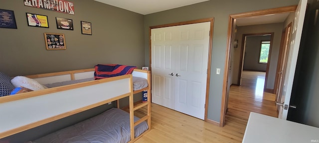360 E 350 Rd N, Warsaw, IN 46582 - bedroom featuring light wood-style floors, baseboards, and a closet