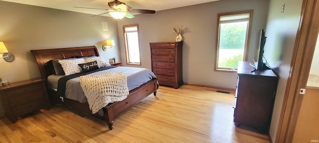 360 E 350 Rd N, Warsaw, IN 46582 - bedroom featuring multiple windows, light wood-style floors, baseboards, and ceiling fan