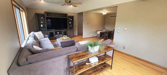 360 E 350 Rd N, Warsaw, IN 46582 - living area featuring ceiling fan, light wood finished floors, and baseboards