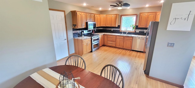 360 E 350 Rd N, Warsaw, IN 46582 - kitchen featuring stainless steel appliances, a sink, decorative backsplash, a ceiling fan, and recessed lighting