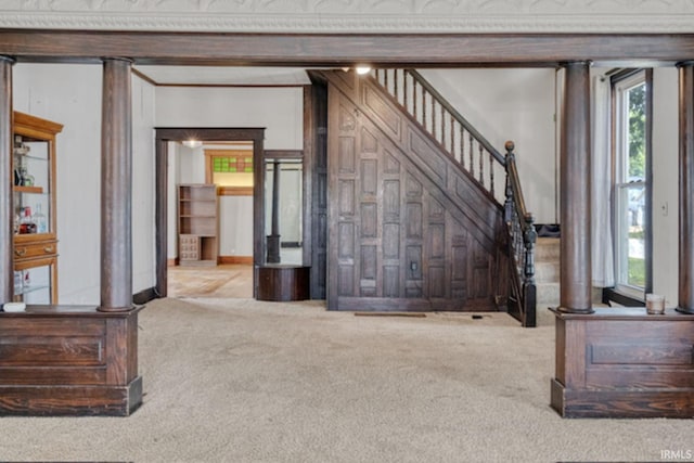 128 E Grant St, Greentown, IN 46936 - living area with carpet, healthy amount of natural light, stairway, and decorative columns