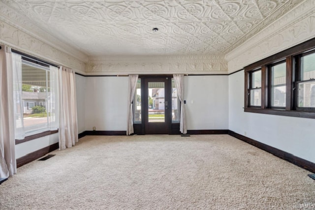 128 E Grant St, Greentown, IN 46936 - carpeted empty room featuring healthy amount of natural light and baseboards