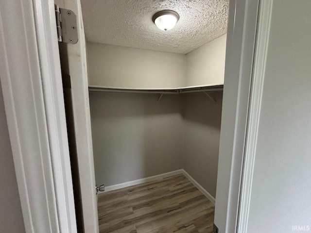 724 Iroquois Dr, Anderson, IN 46012 - walk in closet featuring wood finished floors