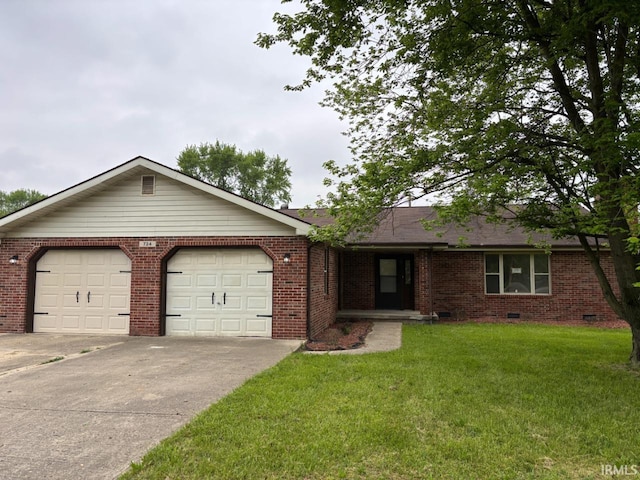 724 Iroquois Dr, Anderson, IN 46012 - single story home featuring an attached garage, driveway, a front yard, brick siding, and crawl space