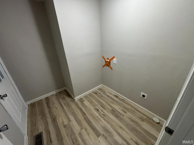 724 Iroquois Dr, Anderson, IN 46012 - washroom featuring light wood finished floors, baseboards, and hookup for an electric dryer