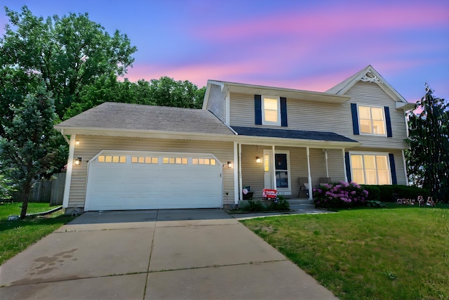 1617 Bennington Dr, Mishawaka, IN 46544 - traditional-style house featuring a porch, a front lawn, an attached garage, and concrete driveway