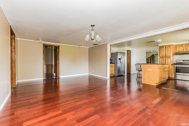7782 S Warren Rd, Warren, IN 46792 - unfurnished living room with a chandelier, dark wood-style flooring, and baseboards