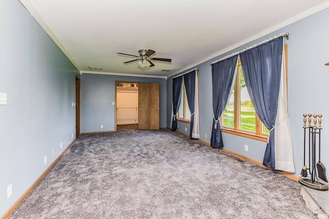 7782 S Warren Rd, Warren, IN 46792 - unfurnished bedroom featuring crown molding, baseboards, carpet flooring, and ceiling fan