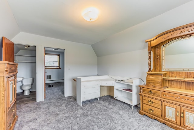 7782 S Warren Rd, Warren, IN 46792 - office area with light colored carpet, lofted ceiling, and a baseboard heating unit