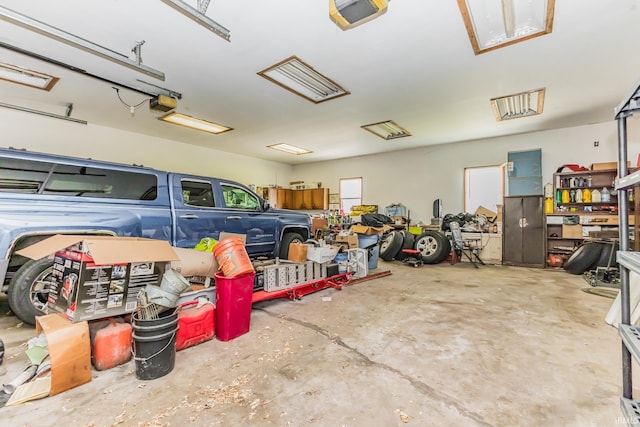 7782 S Warren Rd, Warren, IN 46792 - garage featuring a garage door opener