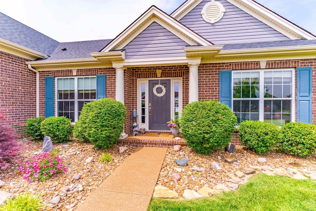 7937 Boydon Ct, Evansville, IN 47715 - property entrance with brick siding and roof with shingles