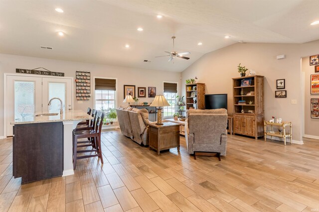 7937 Boydon Ct, Evansville, IN 47715 - living area featuring a ceiling fan, light wood-style flooring, recessed lighting, lofted ceiling, and baseboards