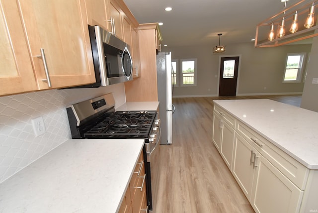 4831 N 400 W, Earl Park, IN 47942 - kitchen with stainless steel appliances, open floor plan, light wood-style floors, decorative backsplash, and recessed lighting