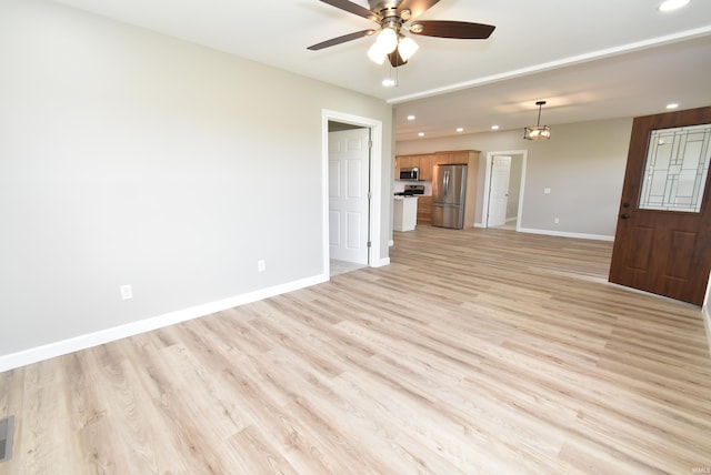 4831 N 400 W, Earl Park, IN 47942 - unfurnished living room featuring recessed lighting, a ceiling fan, light wood finished floors, and baseboards