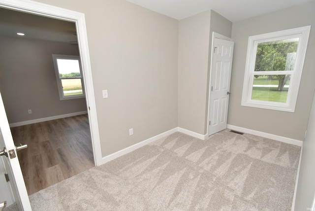 4831 N 400 W, Earl Park, IN 47942 - spare room featuring plenty of natural light, baseboards, and carpet