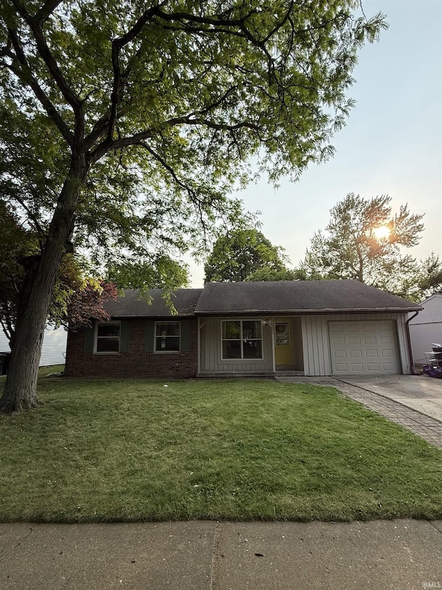 3224 Commanche Trl, Lafayette, IN 47909 - single story home with an attached garage, concrete driveway, and a front lawn