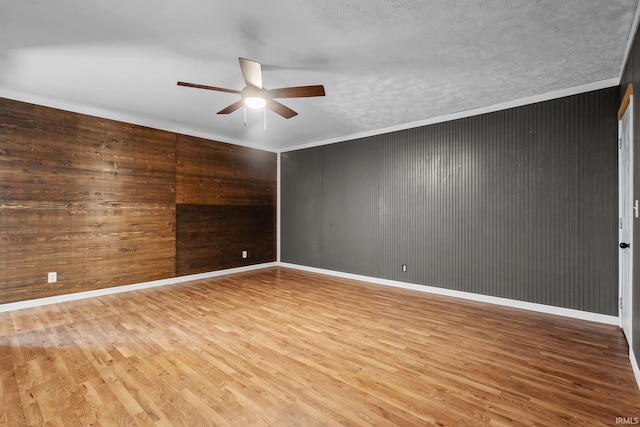 211 Condo St, Monticello, IN 47960 - unfurnished room with ceiling fan, wood finished floors, ornamental molding, baseboards, and a textured ceiling
