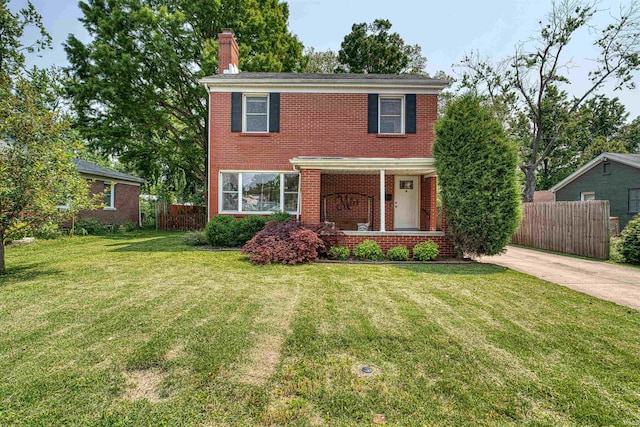 3017 E Walnut St, Evansville, IN 47714 - view of front of property with brick siding, a chimney, and a porch