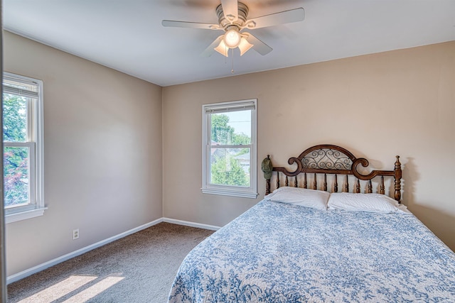 3017 E Walnut St, Evansville, IN 47714 - carpeted bedroom with baseboards and a ceiling fan