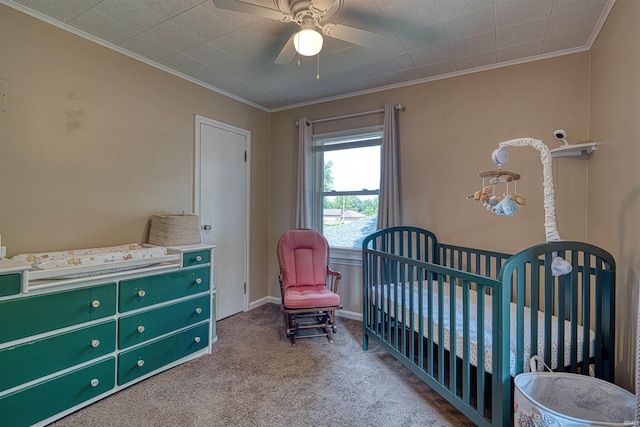 3017 E Walnut St, Evansville, IN 47714 - carpeted bedroom featuring crown molding, a crib, and a ceiling fan
