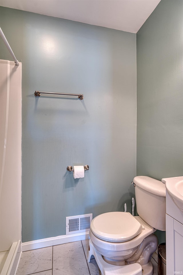 3017 E Walnut St, Evansville, IN 47714 - bathroom featuring baseboards, toilet, vanity, and a shower