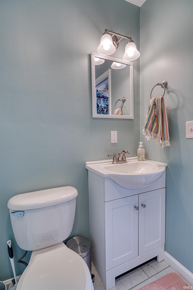 3017 E Walnut St, Evansville, IN 47714 - bathroom featuring toilet, vanity, and baseboards