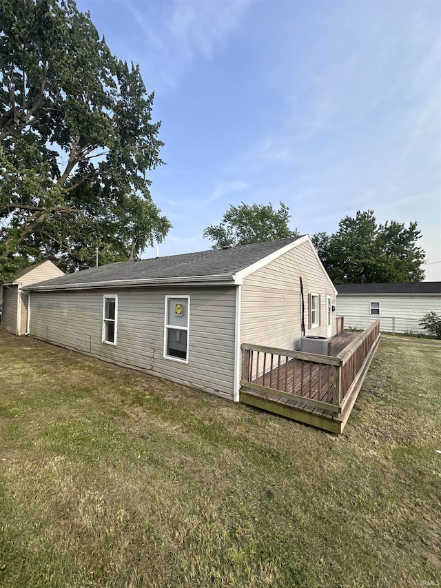 1406 N Philips St, Kokomo, IN 46901 - back of house featuring a deck and a lawn