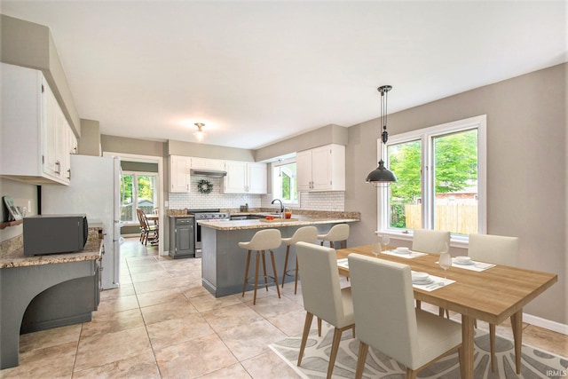 54559 Whispering Oak Dr, Mishawaka, IN 46545 - dining area featuring light tile patterned floors and baseboards