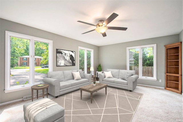 54559 Whispering Oak Dr, Mishawaka, IN 46545 - carpeted living area with ceiling fan and baseboards