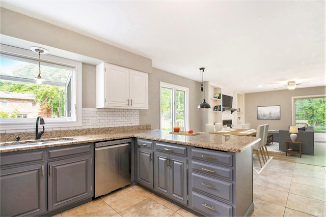 54559 Whispering Oak Dr, Mishawaka, IN 46545 - kitchen featuring dishwasher, a sink, gray cabinets, a peninsula, and light tile patterned floors