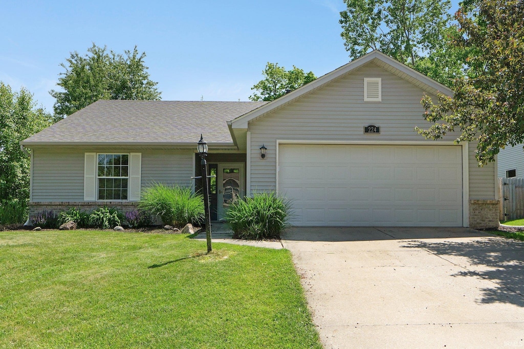 224 Spring Forest Ct, Fort Wayne, IN 46804 - single story home with a garage, a front lawn, driveway, brick siding, and a shingled roof